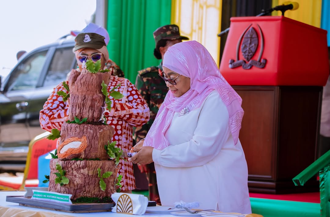 President of the United Republic of Tanzania, H.E. Dr. Samia Suluhu Hassan, cutting a birthday cake after leading a tree-planting exercise at Bungi Kilimo in South Unguja Region on January 27, 2026.