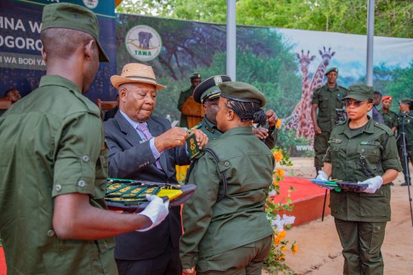 Maj. Gen. (Rtd) Hamis Semfuko conferring military ranks on newly promoted Conservation Commissioners during an official ceremony at TAWA Headquarters in Morogoro.