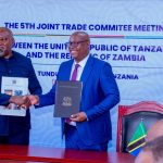 Government officials from Tanzania and Zambia during the Joint Trade Committee Ministerial Meeting in Tunduma discussing trade facilitation and regional economic integration.