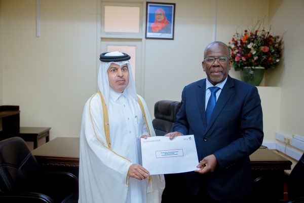 Finance Minister Khamis Mussa Omar receiving a special message from Qatar Ambassador Fahad Rashid Al-Marekhi during bilateral talks at the Ministry of Finance offices in Dar es Salaam.