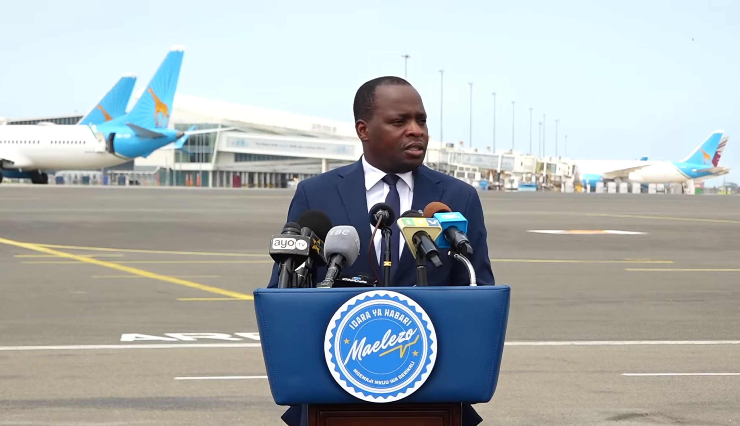 Chief Government Spokesperson delivering an official statement to the media on national matters in Tanzania.
