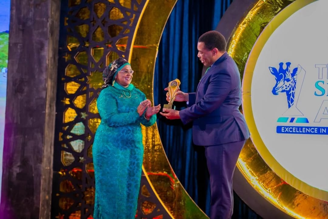 Tourism stakeholders receiving recognition at the Serengeti Awards ceremony celebrating excellence in conservation and hospitality in Tanzania.