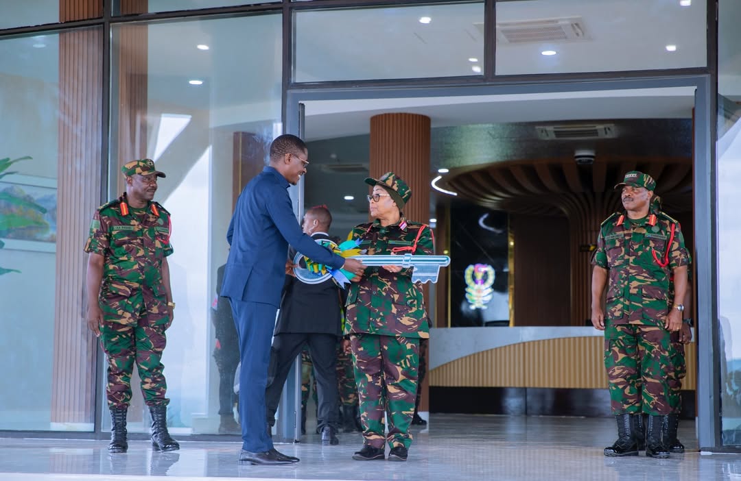 President Samia Suluhu Hassan handing over the keys of the National Defence Headquarters (MMUT) building to Defence Minister Dr. Rhimo Simeon Nyansaho in Dodoma on 24 February 2026.