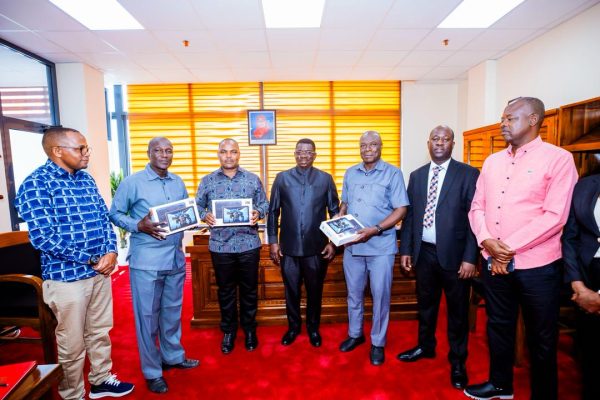 Deputy Minister Dr. Switbert Zacharia Mkama handing over tablets to Ukerewe District Executive Director Vincent Augustine Mbua at Mtumba Government City in Dodoma.
