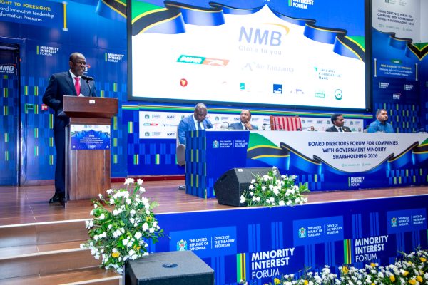 Finance Minister Khamis Mussa Omar speaking at the Minority Shareholding Companies Forum in Arusha, highlighting growth in government investment returns.