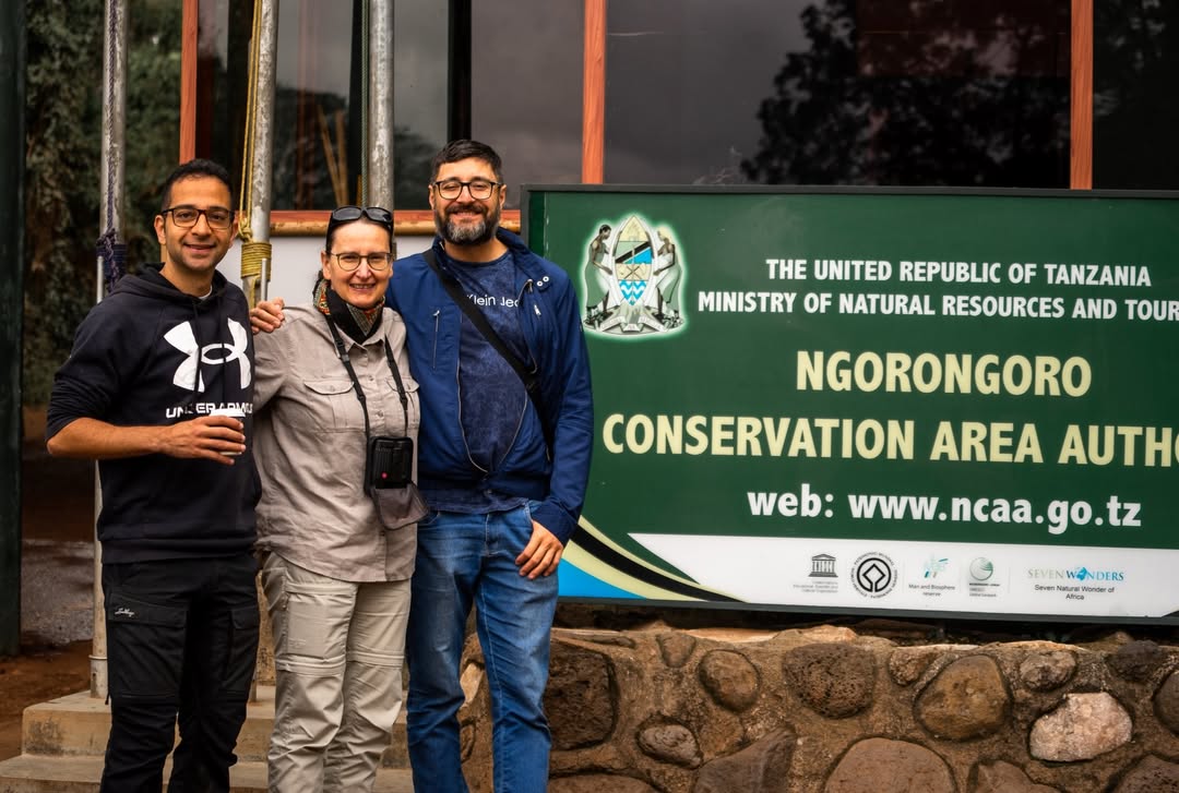 Tourists exploring Ngorongoro Crater with panoramic views from the rim and wildlife including rare black rhinos in Tanzania’s Ngorongoro Conservation Area.