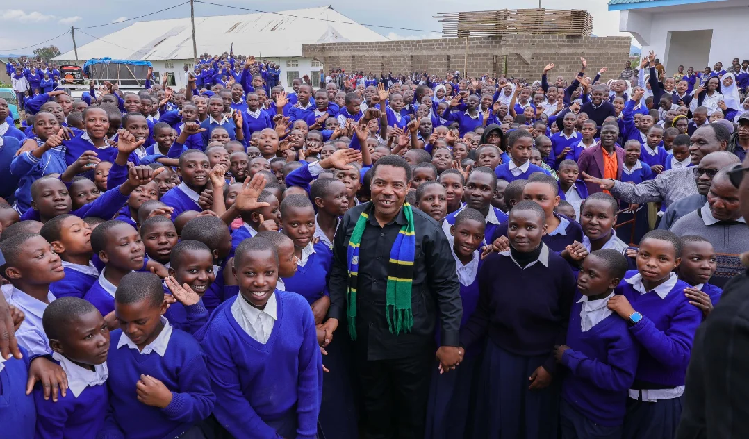 Prime Minister Mwigulu Nchemba speaking to students in Rukwa about the Samia Scholarship program that funds top Tanzanian students to study abroad.