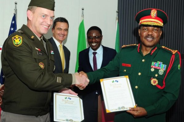 Tanzania Defence Minister Rhimo Nyansaho and U.S. officials witness the signing of a defence cooperation agreement between the Tanzania People’s Defence Force and the Nebraska National Guard in Dar es Salaam.