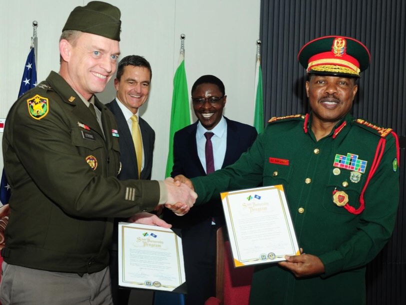 Tanzania Defence Minister Rhimo Nyansaho and U.S. officials witness the signing of a defence cooperation agreement between the Tanzania People’s Defence Force and the Nebraska National Guard in Dar es Salaam.