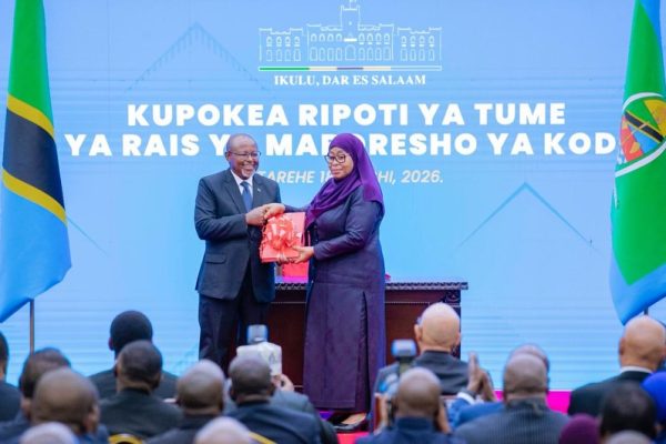 President Samia Suluhu Hassan receiving tax reform report from Ambassador Ombeni Sefue at State House Dar es Salaam