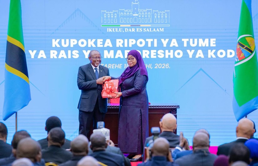 President Samia Suluhu Hassan receiving tax reform report from Ambassador Ombeni Sefue at State House Dar es Salaam