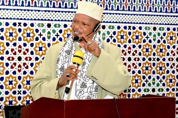 President Samia Suluhu Hassan attending Eid El-Fitr prayers at BAKWATA Grand Mosque in Dar es Salaam with Mufti Abubakar Bin Zubeir addressing worshippers