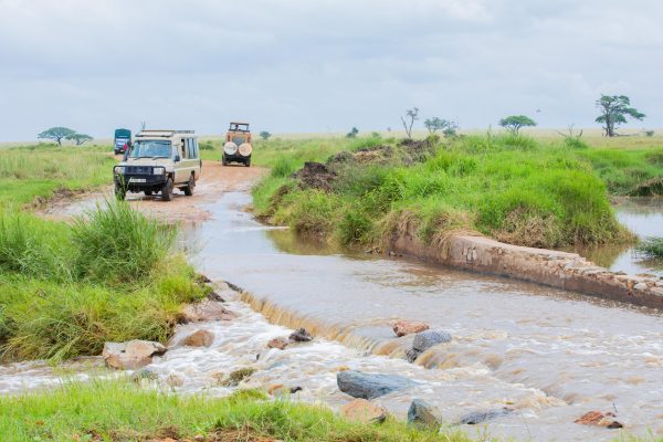 TANAPA Conservation Commissioner Mussa Nassoro Kuji inspecting flood-affected road infrastructure at Serengeti National Park during a working visit on March 1, 2026.