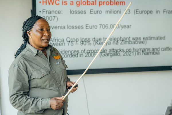 Wildlife scientist Dr. Janemary Ntalwila conducting research on human–wildlife conflict solutions in Tanzania communities near rivers and lakes.