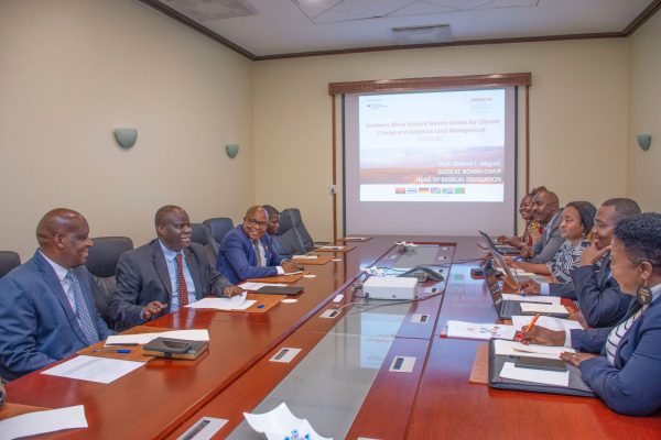 Dr. Richard Muyungi meeting with SASSCAL delegation in Dar es Salaam to discuss climate change research and sustainable land management cooperation.