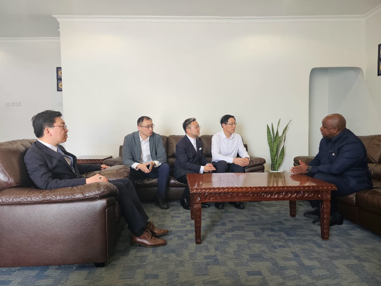Deputy Minister Ngwaru Maghembe meeting Chinese investors from Liaoning Fangda in Dodoma to discuss investment opportunities in Tanzania