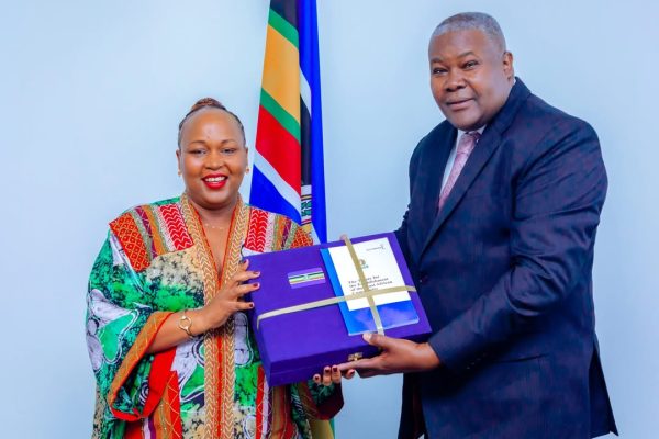 Hon. Veronica M. Nduva handing over office to Amb. Stephen P. Mbundi during the leadership transition ceremony at the East African Community.