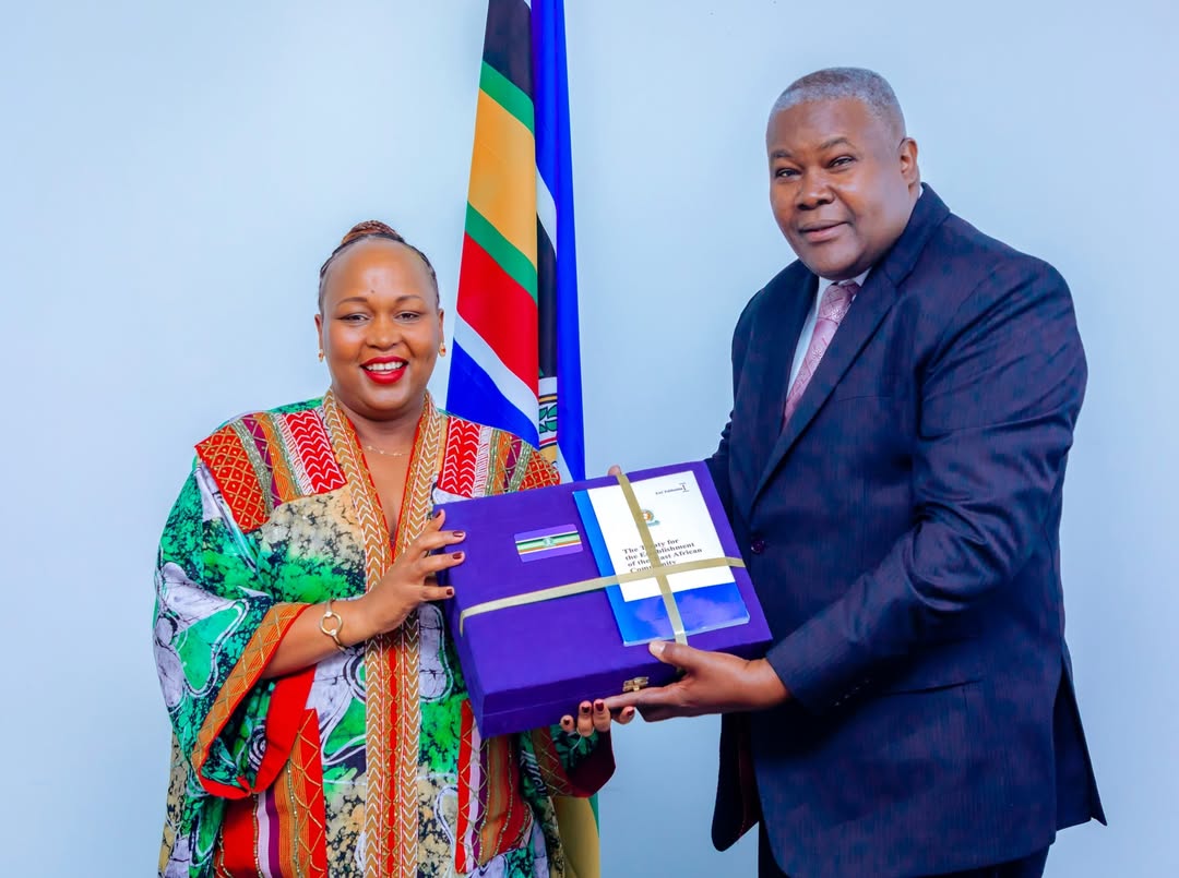 Hon. Veronica M. Nduva handing over office to Amb. Stephen P. Mbundi during the leadership transition ceremony at the East African Community.