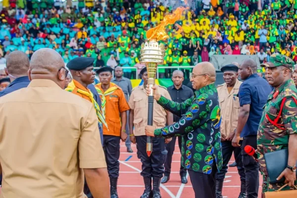 Zanzibar President Dr. Hussein Ali Mwinyi lighting the 2026 National Uhuru Torch at Gombani Stadium in Chake Chake, Pemba