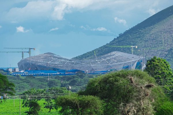A modern stadium under construction in Arusha as part of Tanzania’s preparations to co-host the Africa Cup of Nations 2027, highlighting ongoing infrastructure development.