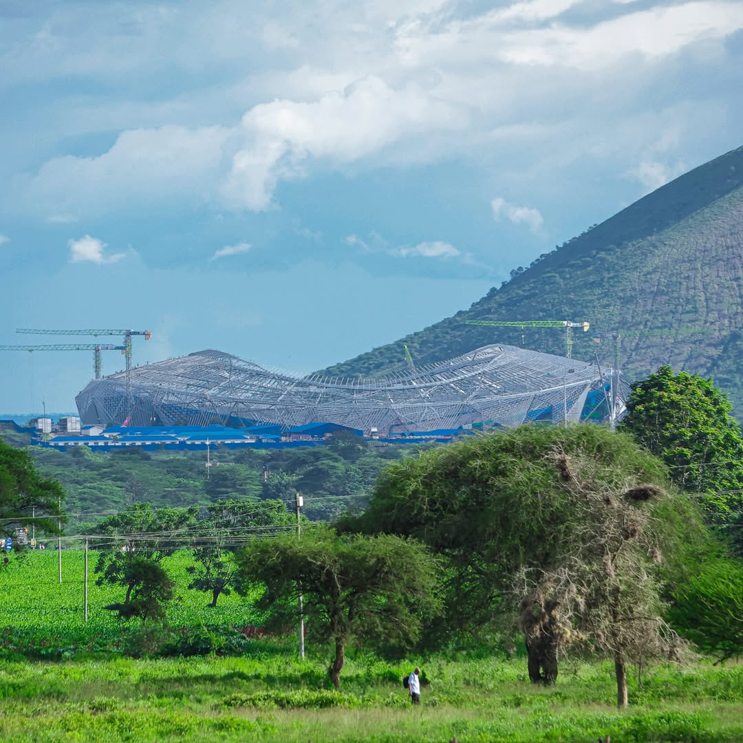 A modern stadium under construction in Arusha as part of Tanzania’s preparations to co-host the Africa Cup of Nations 2027, highlighting ongoing infrastructure development.