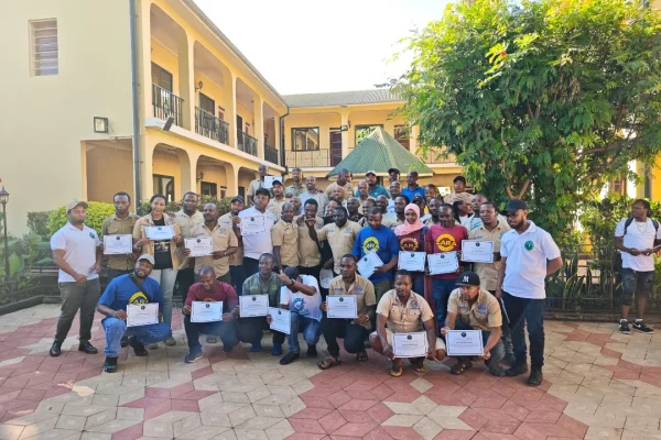 Zara Tanzania Adventures mountain and safari guides receiving certificates during a training and certification ceremony at Springlands Hotel.
