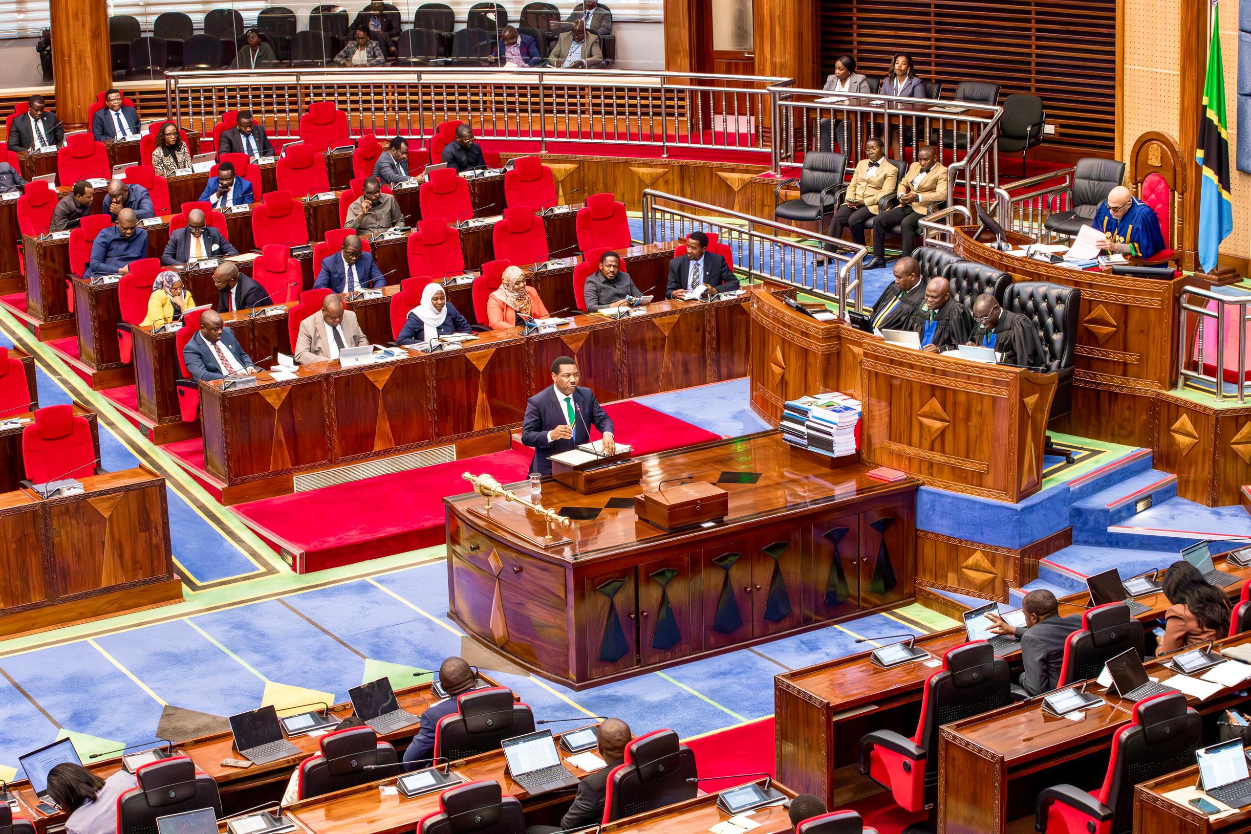 Prime Minister Dr. Mwigulu Nchemba presenting education infrastructure budget in Parliament for 2028 secondary school intake in Dodoma, Tanzania