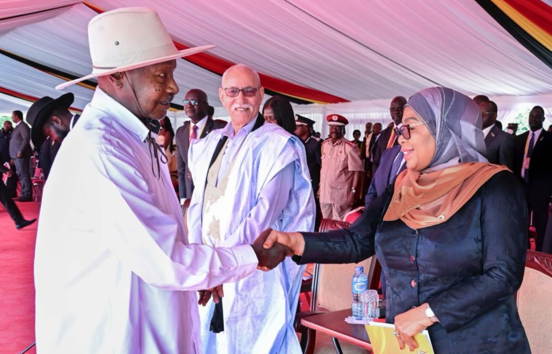 President Samia Suluhu Hassan greeting President Yoweri Kaguta Museveni during the inauguration ceremony at Kololo Ceremonial Grounds.