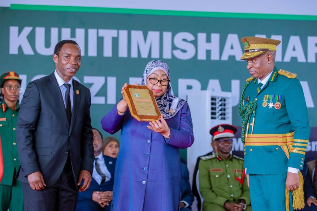 President Samia Suluhu Hassan receiving recognition during a graduation ceremony at the Tanzania Correctional Training College in Ukonga, Dar es Salaam, for her contribution to prisoner rehabilitation and correctional reform.
