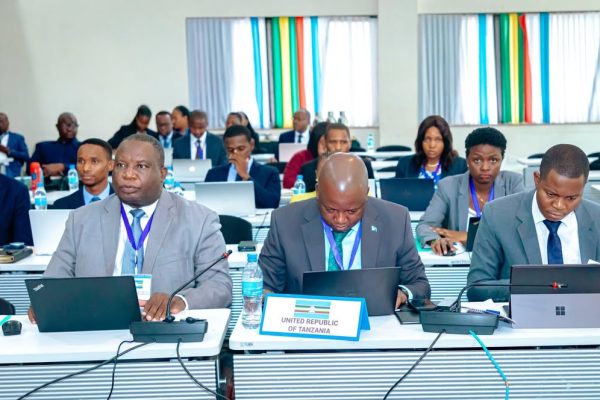 Senior officials attending the 60th Extraordinary Meeting of the East African Community Council of Ministers at the EAC Headquarters in Arusha discussing regional financial and administrative priorities.