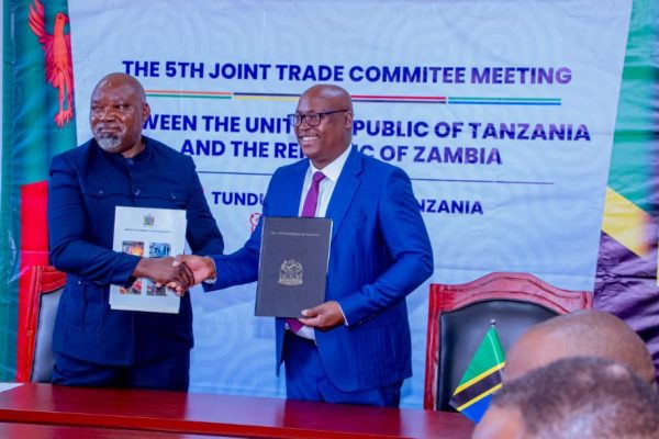 Government officials from Tanzania and Zambia during the Joint Trade Committee Ministerial Meeting in Tunduma discussing trade facilitation and regional economic integration.