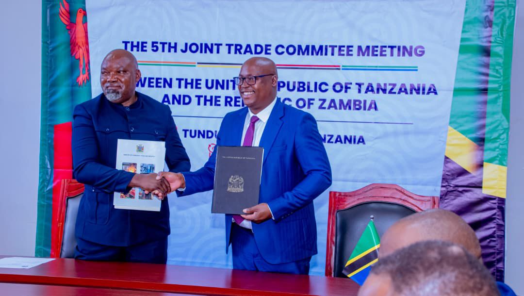 Government officials from Tanzania and Zambia during the Joint Trade Committee Ministerial Meeting in Tunduma discussing trade facilitation and regional economic integration.