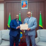 Tanzania’s Foreign Minister Mahmoud Thabit Kombo receiving copies of Letters of Credence from Kenya’s Consul General to Tanzania, H.E. Mohamed Ramadhan Ruwange, during a diplomatic meeting in Dar es Salaam.