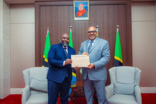 Tanzania’s Foreign Minister Mahmoud Thabit Kombo receiving copies of Letters of Credence from Kenya’s Consul General to Tanzania, H.E. Mohamed Ramadhan Ruwange, during a diplomatic meeting in Dar es Salaam.