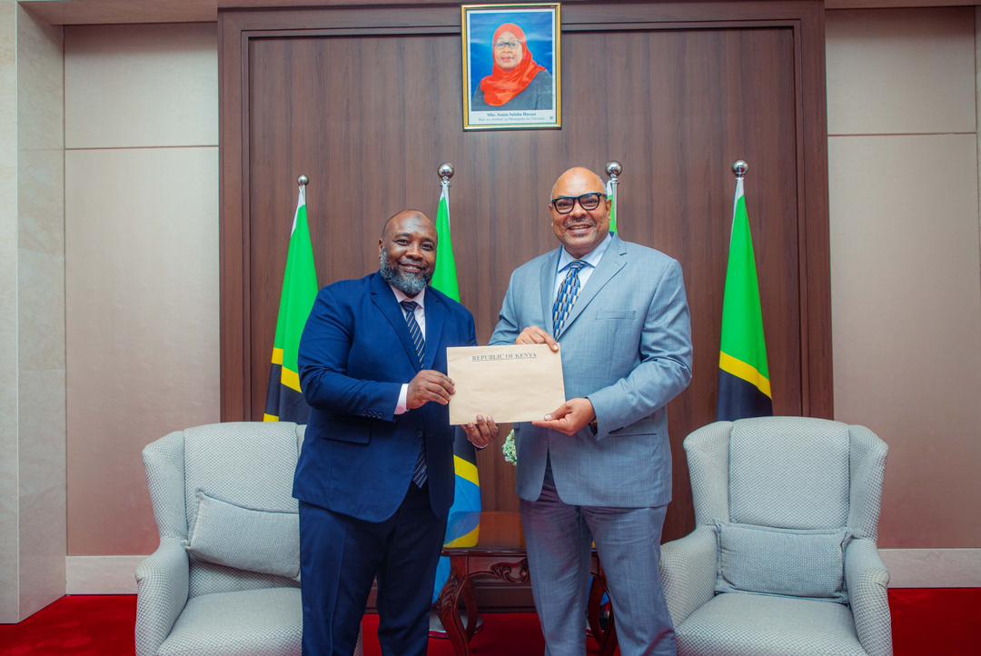 Tanzania’s Foreign Minister Mahmoud Thabit Kombo receiving copies of Letters of Credence from Kenya’s Consul General to Tanzania, H.E. Mohamed Ramadhan Ruwange, during a diplomatic meeting in Dar es Salaam.