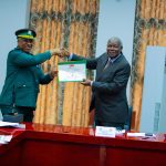 TANAPA Board of Trustees receiving Quality Achievement Award 2026 and National Quality Awards certificate from TANAPA management during an official ceremony in Dar es Salaam.