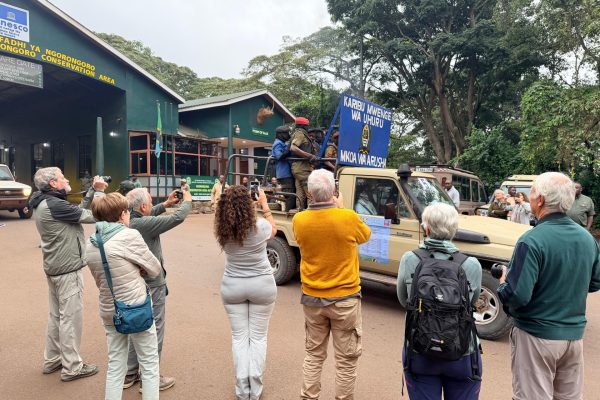International tourists watching Tanzania's Torch of Freedom relay inside the Ngorongoro Conservation Area.